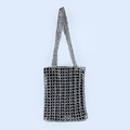 Detailed view of handmade black and silver beaded mesh weaving on a stylish shoulder bag - Silver