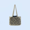 Detail of handcrafted gold beaded shoulder bag featuring a geometric mesh and inner drawstring bag - Gold
