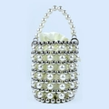 Detailed view of woven pearl bucket bag with silver beads and satin drawstring liner - White