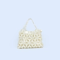 Close-up of handmade pearl handbag with floral weave patterns and silk lining - White