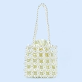 Detail of handmade pearl beaded handbag featuring cream satin drawstring lining and texture - White