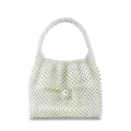 Detailed view of handmade white pearl beaded handbag with large decorative pearl closure - White
