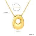Detailed view of golden irregular round pendant on box chain with 40+5cm length scale - O(NE2F500OG)
