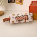 Detail of pink canvas capybara pencil case with 3D embroidery on a cozy desk setup - Three Little Capybaras
