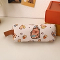 Detail view of a cream canvas Capybara pencil case with cute cartoon prints and handle - Fish