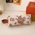 Detail of Capybara canvas pencil case with cute prints and side handle on desk - Bathing