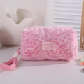 Detail view of pink leopard plush makeup bag with soft texture and sturdy top handle - Rose Red Leopard