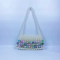 Detail of handmade beaded handbag with white pearls and colorful marble pattern beads - Colorful