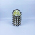 Detail of silver beaded handbag with golden accents and yellow satin drawstring lining - Silver