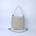 Detailed view of handmade woven pearl handbag with refined metal chain strap - Off White