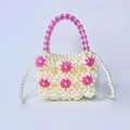 Detail of handmade beaded pearl mini bag featuring pink acrylic floral patterns and strap - Rose Red