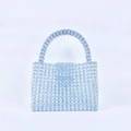 Detail of hand-woven light blue acrylic beads forming a grid texture on the handbag - Light Blue