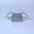 Close-up of silver beaded woven mini bag with metallic finish and trapezoid silhouette - Silver Gray