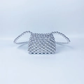 Detailed view of handmade silver beaded mini bag with reflective metallic finish texture - Silver