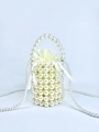 Handmade white pearl bucket bag with gold accents and elegant drawstring inner pouch - Milky White