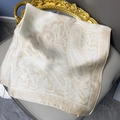 Champagne paisley satin silk square scarf with lace edge on a grey leather chair - 70cmx70cm / Satin Milk Tea Paisley