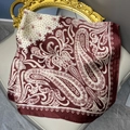 Elegant 70cm vintage paisley and polka dot satin silk square scarf on a luxury chair - 70cmx70cm / Satin Deep Red and Beige Paisley