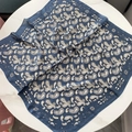 Vintage navy blue paisley square silk scarf for women displayed on marble table - Navy Paisley