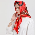 Red silk-textured square scarf with chain pattern worn as a headscarf by a model - CC-Red