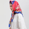 Detail of a silky 90cm square scarf with equestrian chain print and vibrant red-blue patterns - CC-Rose Red