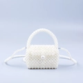 Handmade white faux pearl mini crossbody bag with woven handle and classic flap closure - White