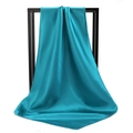Peacock blue satin square headscarf displayed on a minimalist black metal frame - 90*90cm / Teal