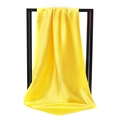 Vibrant yellow silk satin square scarf displayed hanging on a minimal black stand - 90*90cm / Bright Yellow