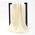 Elegant cream satin square scarf with silky luster on a minimalist black stand - 90*90cm / Beige
