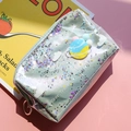 Detail of silver iridescent makeup bag with star sequins and Star Travel logo - Makeup Bag / Planet Cosmetic Bag Green