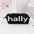 Detail of black canvas pencil case with oversized plastic zipper and hally logo - Black