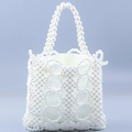 Elegant white pearl woven handbag featuring a hollow geometric design and satin drawstring lining - White