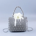 Detail of silver beaded basket bag with white satin drawstring pouch and metallic finish - Silver