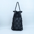 Elegant black beaded handbag with woven hollow grid design and large satin bow detail - Black