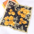 Detail view of square floral silk scarf with yellow roses and satin finish on gift boxes - 1# Recommended Color (Black Yellow Floral)