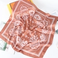 Detail of vintage paisley print silk scarf in orange-brown satin with a gift box - Brick Red