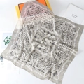 Detailed close-up of champagne paisley silk square scarf with fine rolled edge finish - 70cmx70cm / Gray