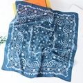 Macro shot of navy blue paisley floral silk scarf with luxury branding and textures - 70cmx70cm / Teal