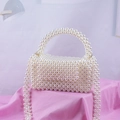 Handmade pearl beaded pillow bag with top handle and shoulder strap for elegant women - White