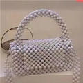 Elegant white faux pearl beaded handbag with woven top handle and long pearl crossbody strap - Milky White