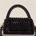 Handmade black beaded pillow bag with top handle and crossbody strap design - Black