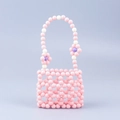 Mini sac à main artisanal en perles roses avec motif à carreaux et fleurs de marguerite - Rose