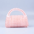 Handmade beaded handbag with pink and clear acrylic beads in a gradient woven design - Watermelon red