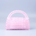 Handmade beaded handbag with pink and white acrylic beads in a trendy trapezoid shape - Pink