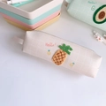 Detail of a creamy white pencil case featuring a pineapple embroidery and mesh pattern - Pineapple (Beige)