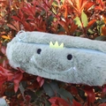 Cute light green plush dinosaur pencil case with soft texture and cartoon embroidery - Cylindrical Dinosaur Case (Smile Style)