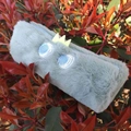 Plush dinosaur pencil case in mint green faux fur with yellow felt crown and blue eyes - Cylindrical Dinosaur Case (Squint Eyes)