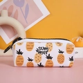 Detail of white pencil case with yellow pineapple pattern and bold black zipper closure - Pineapple