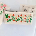 Detail of cute canvas pencil case showing strawberry floral prints and black zipper closure - Yellow Flower
