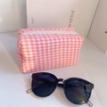 Detailed view of pink and white houndstooth fabric texture on a square makeup bag - 18*10 / Pink White