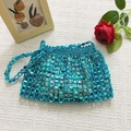 Lake blue beaded woven handbag featuring metallic luster and artisanal disc beads - Blue